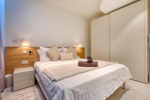 Ένα ή περισσότερα κρεβάτια σε δωμάτιο στο Mercury Suites 1BR Apartment - 7th Floor