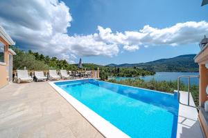 a swimming pool in a villa with a view at Holiday Home Nina Plitvine in Vela Luka