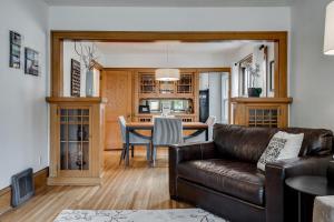 a living room with a couch and a table at Grand Residence in Saint Paul