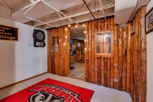 a room with wooden walls and a red carpet at Grand Residence in Saint Paul