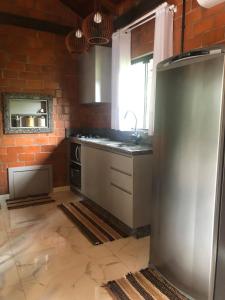 Kuchyň nebo kuchyňský kout v ubytování Casa di Pipa com ofurô
