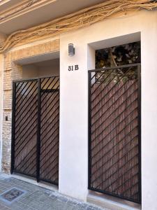 a garage door with a black iron gate at GREEN&FRESH Apartament in Valencia