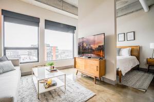 a living room with a bed and a couch at Sable 801 - Alcove in Minneapolis +36 photos