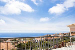a view of the ocean from the balcony of a condo at Villa Izilda by ESCAPE to Madeira in Ponta do Sol