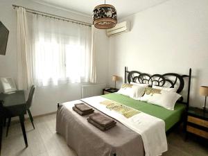 Ένα ή περισσότερα κρεβάτια σε δωμάτιο στο Rematia Cosy Apartment