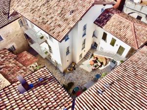an overhead view of a large white building with red roofs at Passer Relais Bistrot in Menaggio