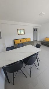 a meeting room with a white table and chairs at Villa Dian in Neum +37 photos