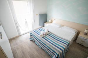 Posteľ alebo postele v izbe v ubytovaní Residence Rimini Mare