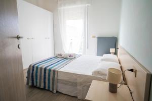 Posteľ alebo postele v izbe v ubytovaní Residence Rimini Mare