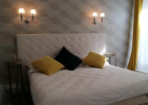Postel nebo postele na pokoji v ubytování Régina Boutique Hotel