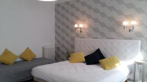 Postel nebo postele na pokoji v ubytování Régina Boutique Hotel