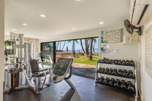 a gym with exercise equipment and a view of the ocean at Wailea Elua 2305 by Coldwell Banker Island Vacations in Wailea