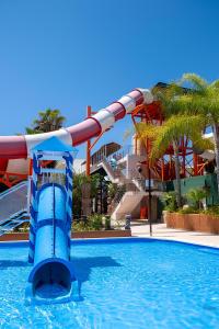 a water slide in a swimming pool at a resort at Royal Oropesa in Oropesa del Mar