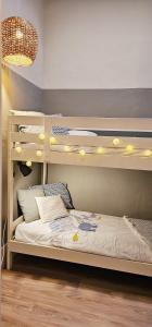 a bedroom with a bunk bed with a ladder at Alma House - Caminha in Caminha +11 photos