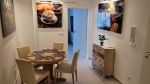 a small dining room with a table and chairs at Vlotho Apartment 2 in Vlotho
