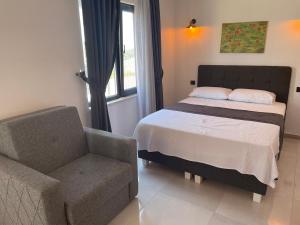 Llit o llits en una habitació de Imbrossa Hotel