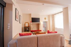 a living room with two couches and a table at Maison raffinée 4 étoiles - Terrasse et Accès train Paris in Meung-sur-Loire +30 photos