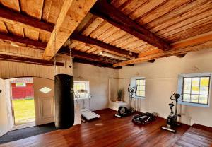 an empty room with a gym with a large object in it at Rosengården - Viby B&Bi in Vretstorp