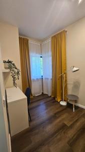 a living room with a desk and a window at Little Bucharest downtown apartments Romana in Bucharest +170 photos