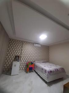 a bedroom with a large bed in a room at Casa para COP 30 in Belém