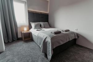 Postel nebo postele na pokoji v ubytování NOVA Apartamenty&Pokoje