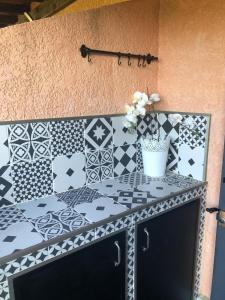 a room with a table with tiles on the wall at Superb studio for 4 people in Le Lavandou