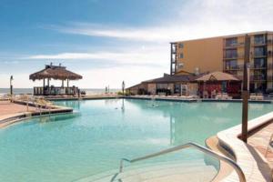 a large swimming pool next to a building at Ocean View Condo in Daytona Beach