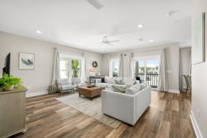 a living room with a couch and a table at Beach House - Marina View by Panhandle Getaways in Port Saint Joe