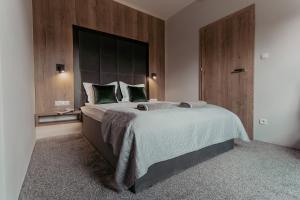 Postel nebo postele na pokoji v ubytování NOVA Apartamenty&Pokoje
