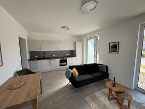 a living room with a couch and a table at Appartement Sonnenblume in Spangenberg