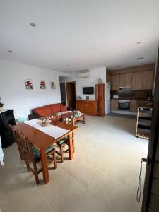 a living room with a table and a couch at Can Sais in Pals