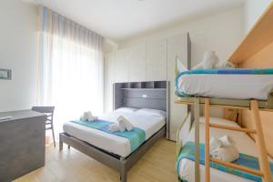 Postel nebo postele na pokoji v ubytování Hotel Colorado