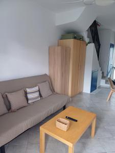 a living room with a couch and a coffee table at Nicholas House in Siviri +27 photos