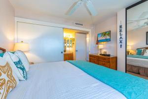 Ένα ή περισσότερα κρεβάτια σε δωμάτιο στο Sugar Beach Resort PH8 by Coldwell Banker Island Vacations +39 φωτογραφίες