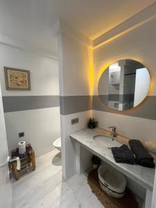 a bathroom with a sink and a mirror at Stay In GAUTHIER studio s in Casablanca