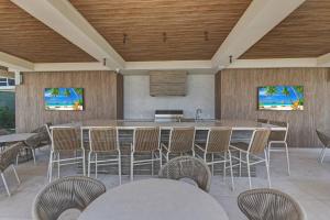 a large room with a large table and chairs at Beachfront 3 bedroom Luxury Residence in Nassau