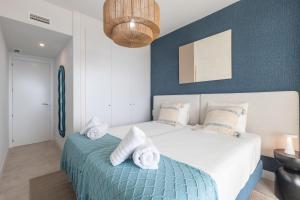 a bedroom with a bed with towels on it at Casa El EDEN 39 in Mijas +42 photos