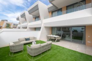 an exterior view of a building with a lawn at Casa El EDEN 39 in Mijas