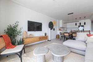 a living room with a couch and a table at Casa El EDEN 39 in Mijas