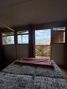 Postel nebo postele na pokoji v ubytování LA CASA DE RICKY "El balcón de las Montañas"
