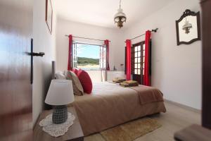 En eller flere senge i et værelse på Casa Morais