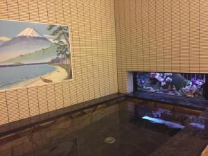 TV a/nebo společenská místnost v ubytování Tobaya Ryokan