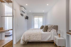 Ένα ή περισσότερα κρεβάτια σε δωμάτιο στο Sunrise House MET Oliva nova