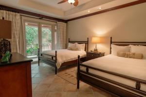 a bedroom with two beds and a window at CR Luxury Terrazas De Marbella 3A 3 Bdrm in La Mona +26 photos