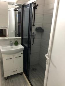 a bathroom with a shower and a sink at MarBel Apartments in Ohrid +21 photos