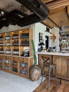 a bar with a counter and a chair in a room at To Be Social House in Fethiye