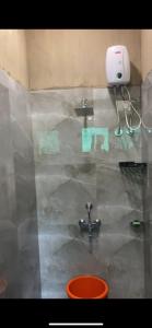 a bathroom with a sink and a faucet at Hornbill Soirees Homestay - Aros, North of Goa in Sawantwadi