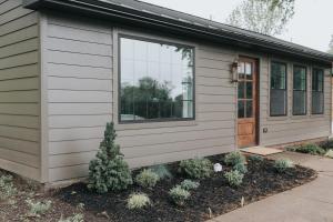 a small house with a door and some plants at Luxury Cabin at Beaver Creek with hot tub and stunning views in Strasburg
