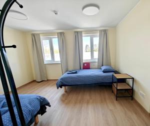 Postel nebo postele na pokoji v ubytování Meierei kohviku majutus