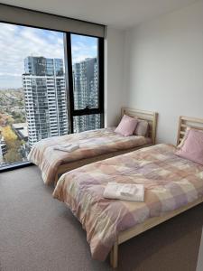Postel nebo postele na pokoji v ubytování Prospect Box Hill 2BR Apt with City Views L21 + 22 fotografií